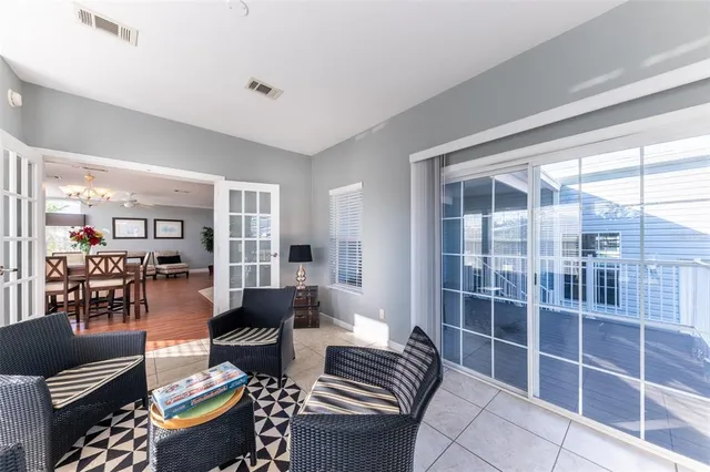 a bedroom with two beds and lamps