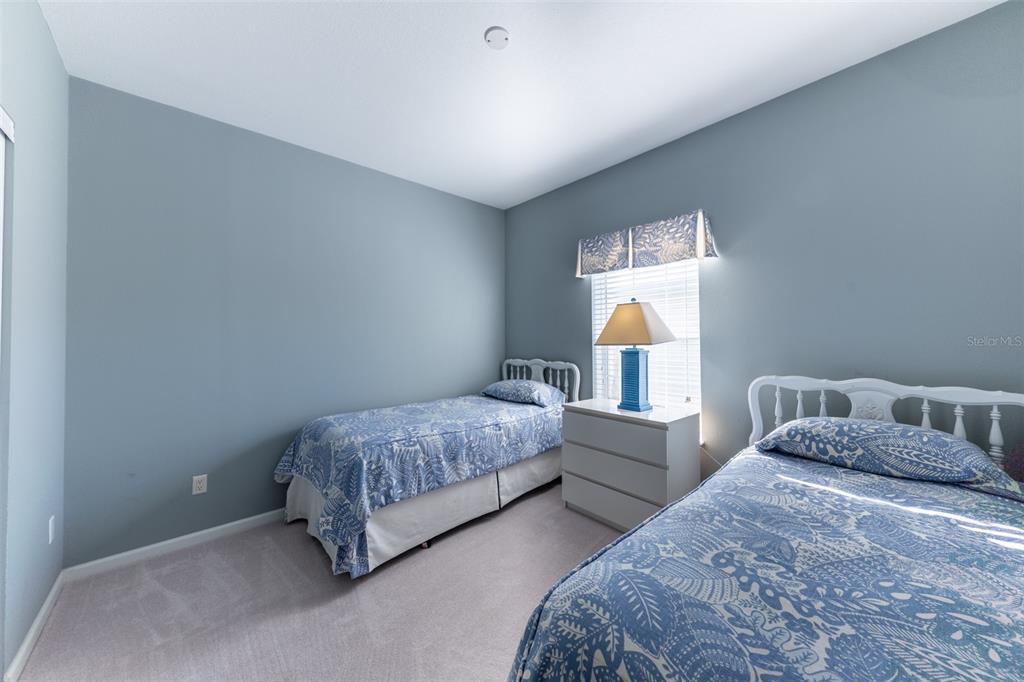 2 Emden Circle Punta Gorda, FL 33950 - Photo 31 of 60 a bedroom with two beds and lamps