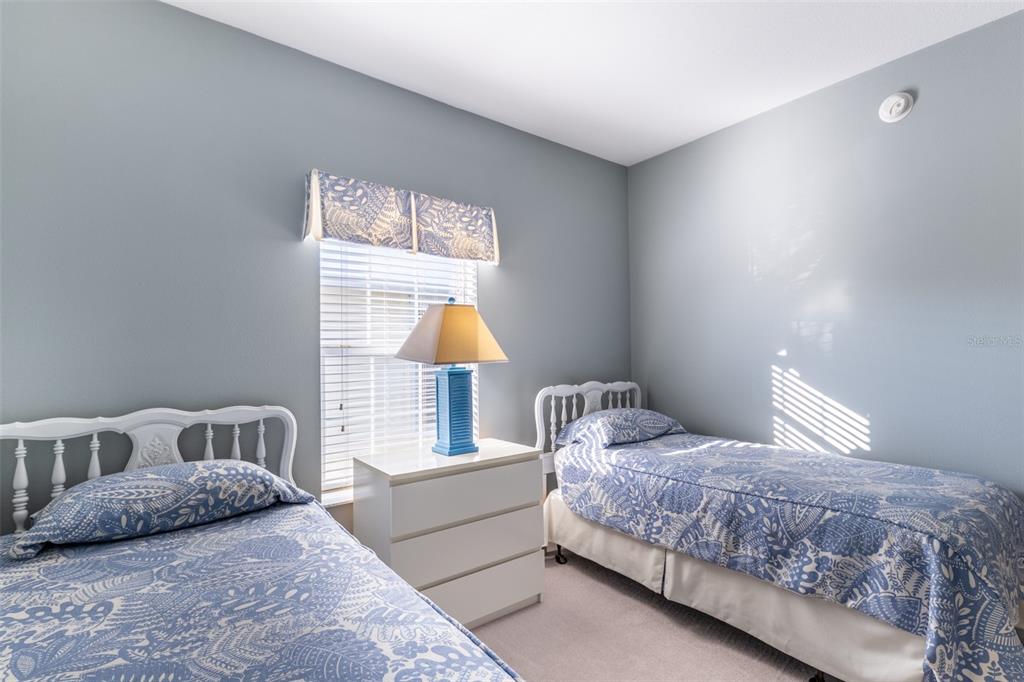 2 Emden Circle Punta Gorda, FL 33950 - Photo 32 of 60 a bedroom with a bed and a lamp