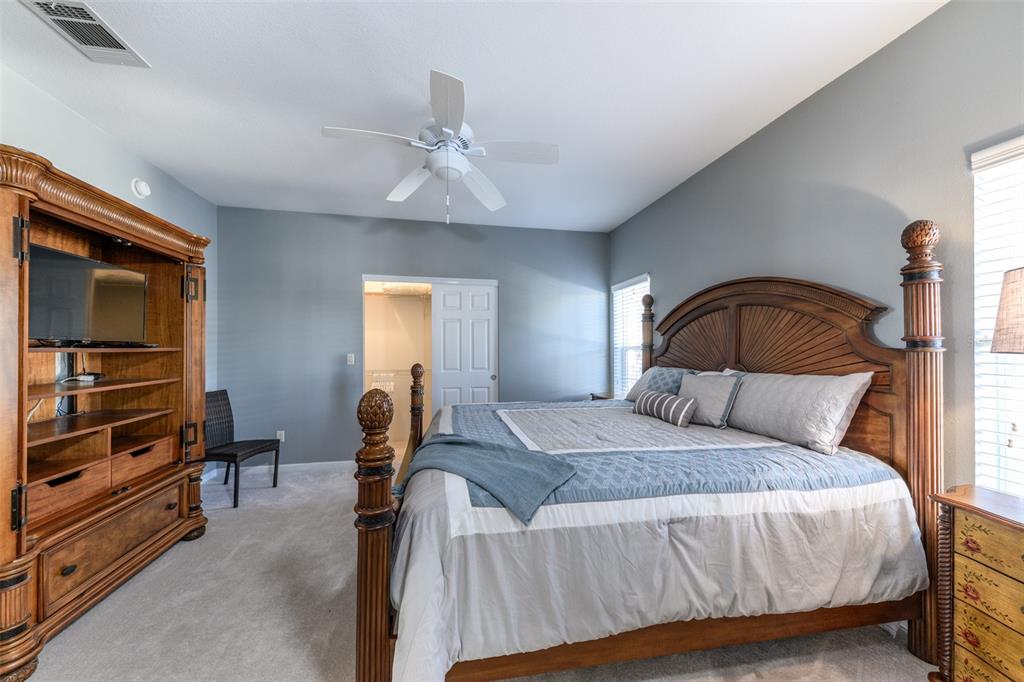 2 Emden Circle Punta Gorda, FL 33950 - Photo 37 of 60 a bedroom with a bed and dresser