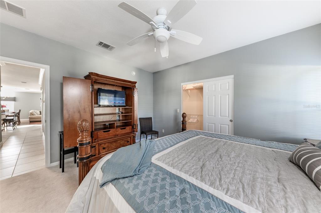 2 Emden Circle Punta Gorda, FL 33950 - Photo 38 of 60 a bedroom with a bed and a flat screen tv