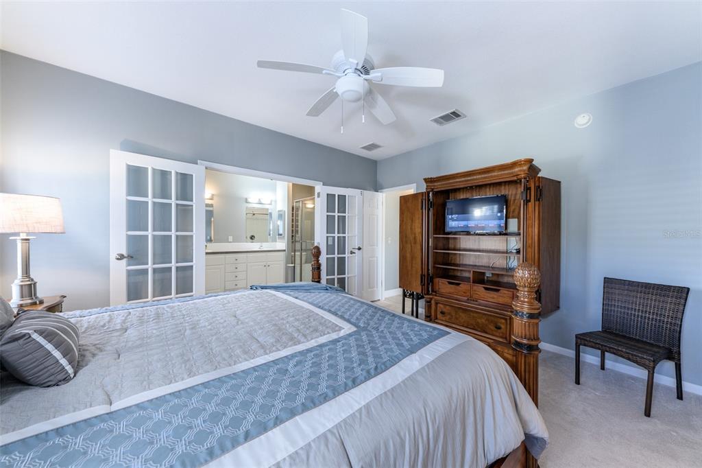 2 Emden Circle Punta Gorda, FL 33950 - Photo 39 of 60 a bedroom with a bed and a flat screen tv