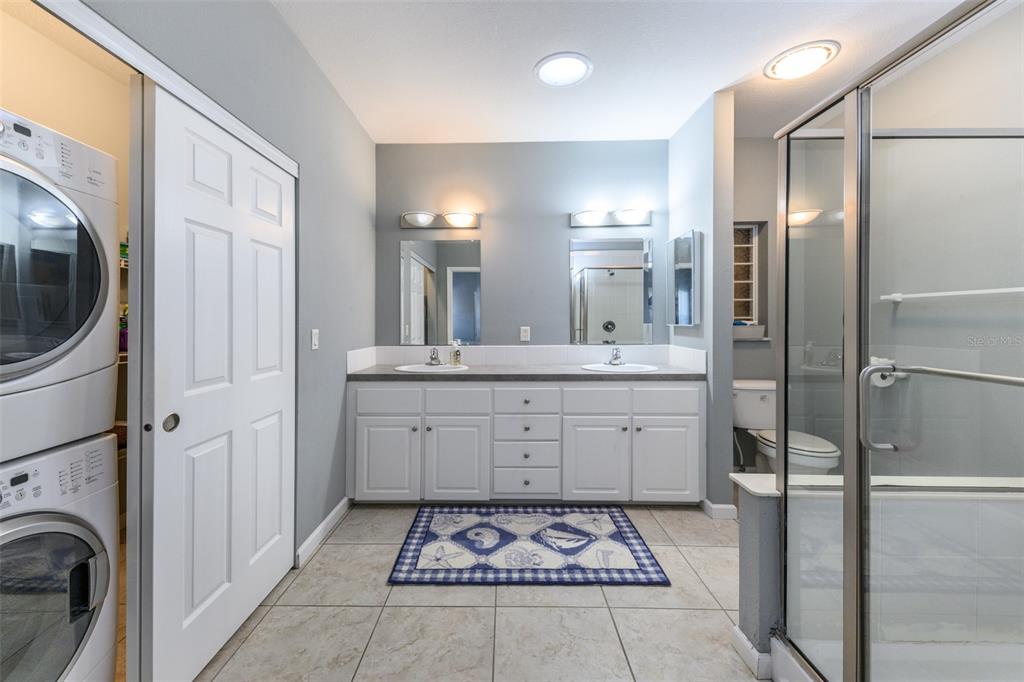 2 Emden Circle Punta Gorda, FL 33950 - Photo 42 of 60 a spacious bathroom with a shower sink and mirror