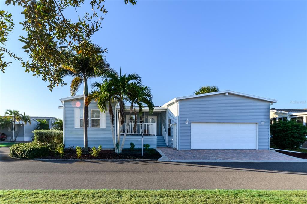 2 Emden Circle Punta Gorda, FL 33950 - Photo 47 of 60 a front view of a house with a yard and garage