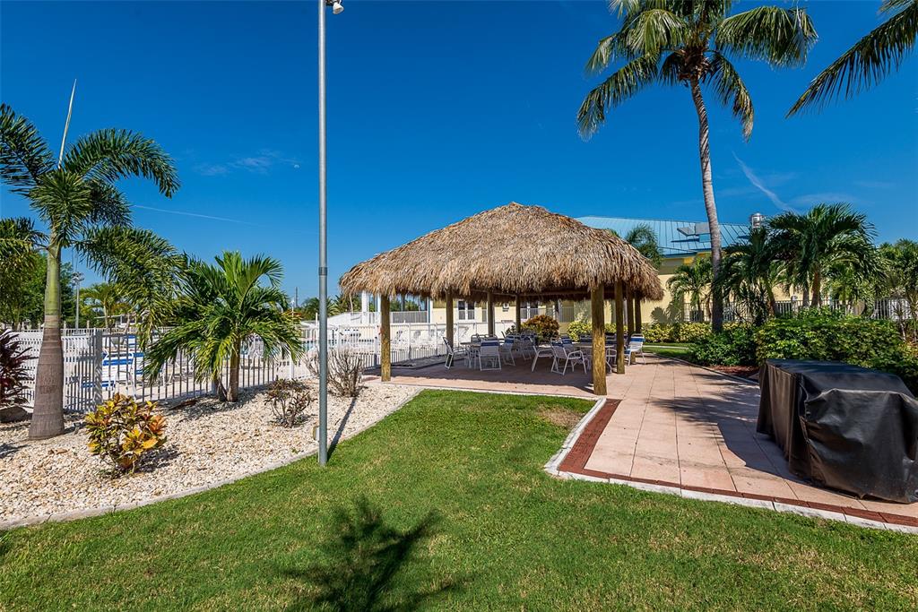2 Emden Circle Punta Gorda, FL 33950 - Photo 54 of 60 a view of a backyard with a garden and swimming pool