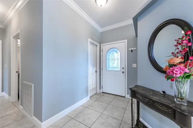 a dining area with furniture a kitchen view and wooden floor