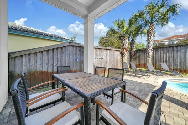 a view of a patio with a table chairs and a patio