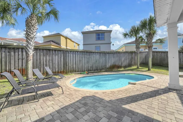 a view of a backyard with a patio
