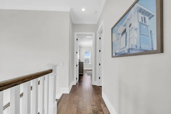a view of room with wooden floor