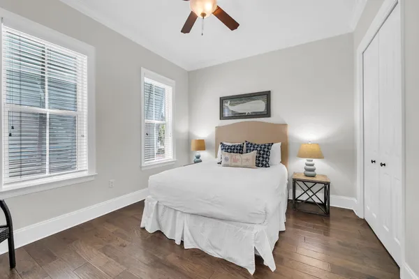 a bedroom with a bed and a chair
