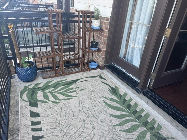 2814 Polk Street Houston, TX 77003 - Photo 9 of 9 a bed sitting in a bedroom next to a window