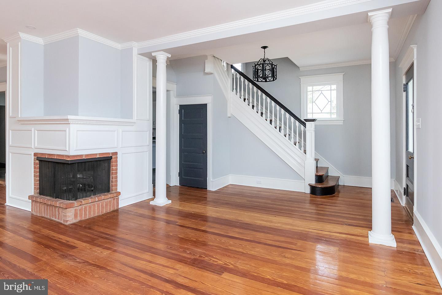 230 North Woodbury Road Pitman, NJ 08071 - Photo 4 of 24 Foyer, fireplace and stair case in living room are
