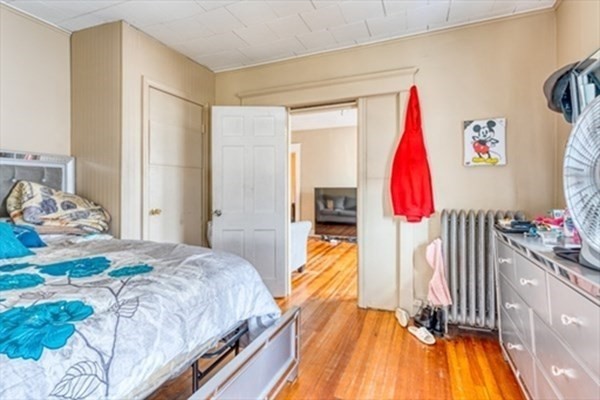 58 Johnson Street Springfield, MA 01108 - Photo 20 of 34 a bed room with a bed and a couch