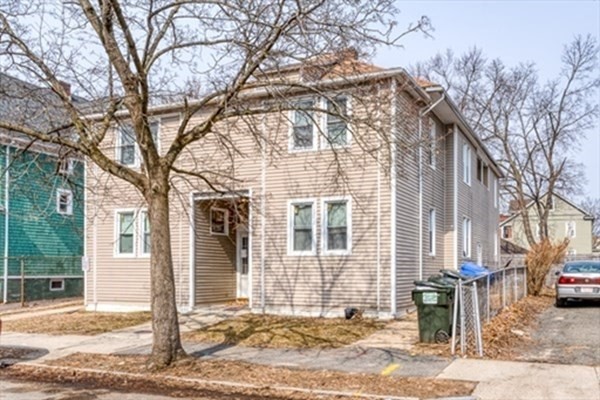 58 Johnson Street Springfield, MA 01108 - Photo 2 of 34 a front view of a house with a tree
