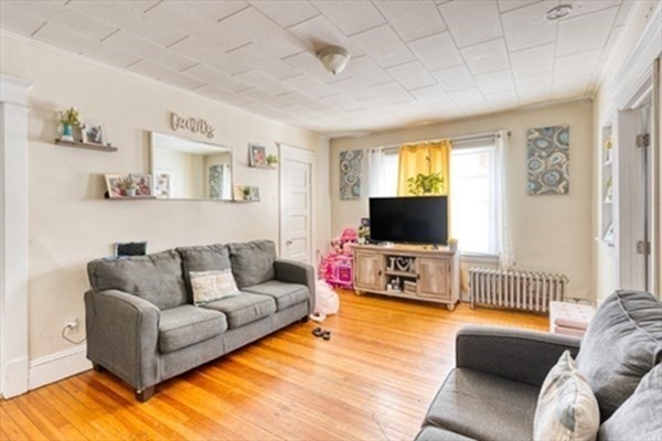 58 Johnson Street Springfield, MA 01108 - Photo 23 of 34 a living room with furniture and a flat screen tv