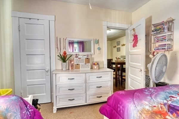 58 Johnson Street Springfield, MA 01108 - Photo 27 of 34 a bedroom with a bed and closet