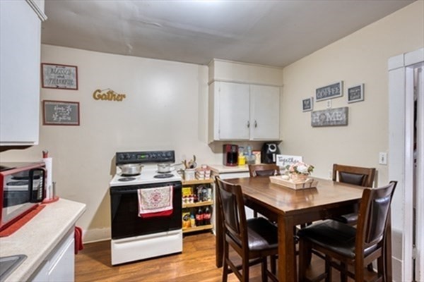 58 Johnson Street Springfield, MA 01108 - Photo 29 of 34 a view of a dining room with furniture and wooden floor
