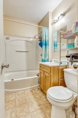 58 Johnson Street Springfield, MA 01108 - Photo 8 of 34 a bathroom with a granite countertop toilet sink and mirror