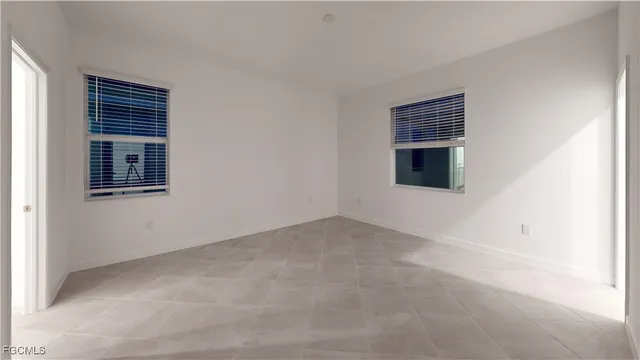 a view of empty room with windows