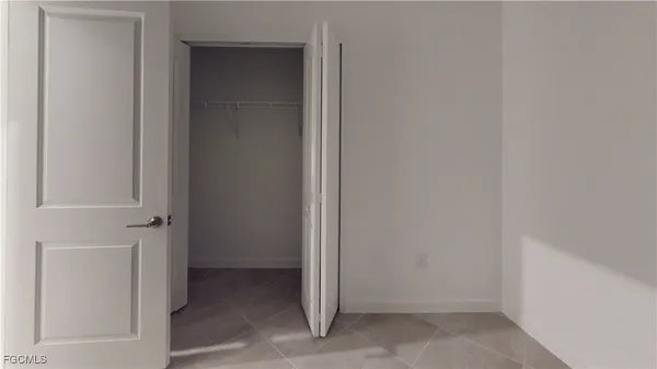 an empty room with a hallway