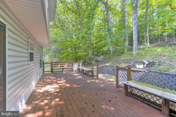 a view of a bench in a backyard