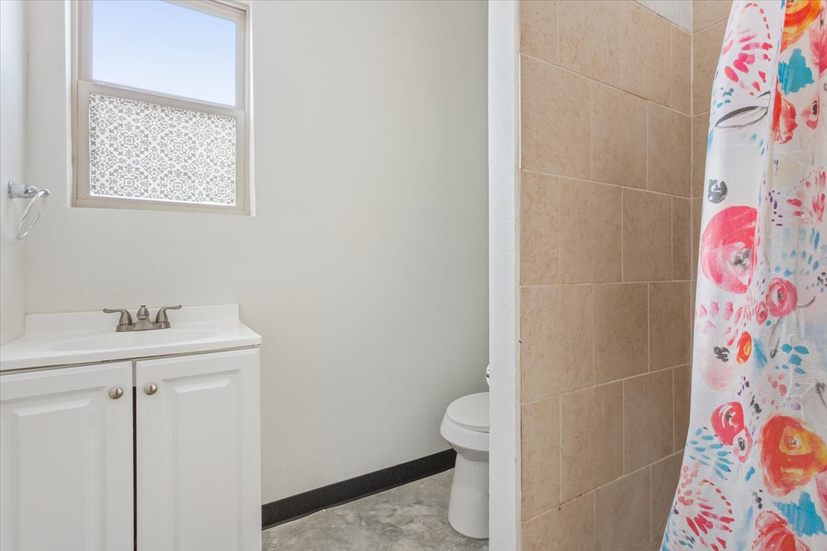 50 Dusty Dam Road Coupland, TX 78615 - Photo 24 of 38 Each bathroom is designed with functionality in mind. Neutral finishes make the spaces easy to maintain and personalize.