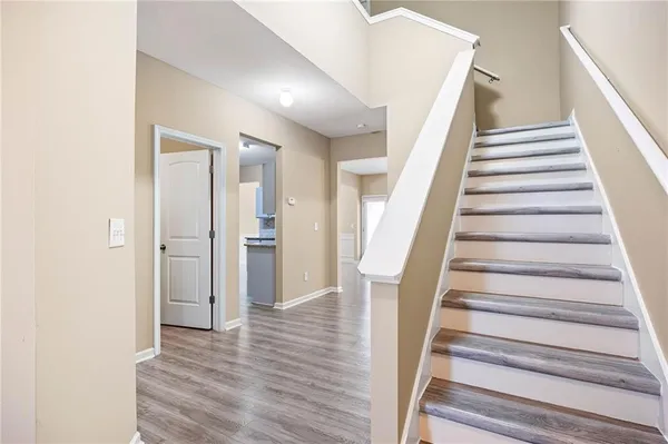 a view of an entryway with wooden floor