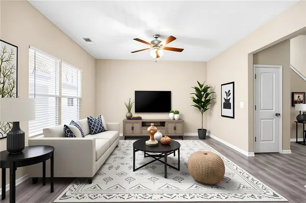a living room with furniture and a flat screen tv
