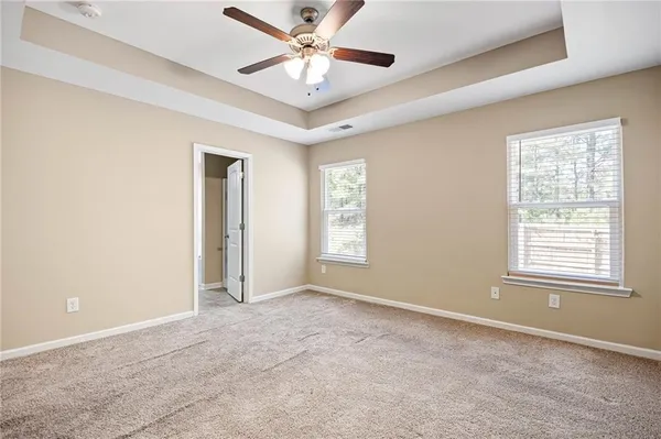a view of an empty room with a window
