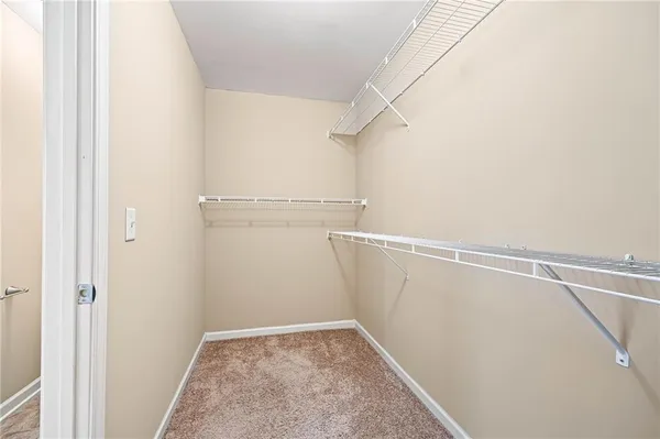 a view of storage and utility room with racks on the wall