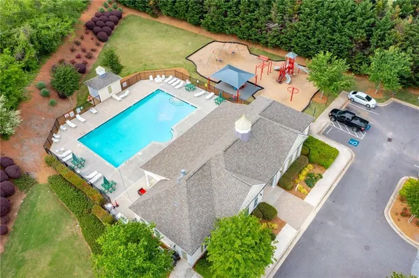 an aerial view of a house with a swimming pool