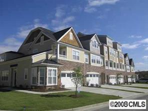 116 Inlet Point Drive, Unit 65 Tega Cay, SC 29708 - Photo 1 of 1 a front view of a house with a yard