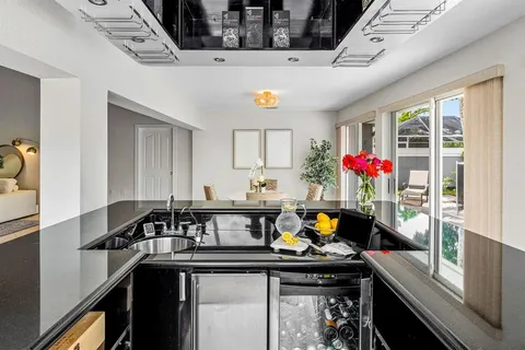 a kitchen with a sink and a refrigerator