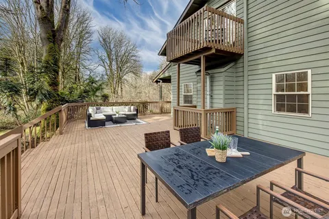 swimming pool view with a seating space