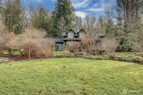 a backyard of a house with lots of green space