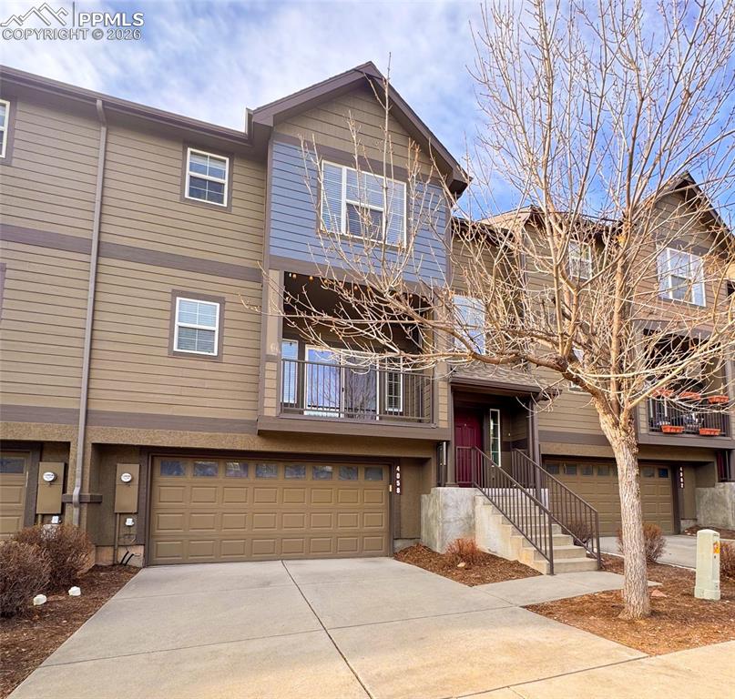4058 Star View Colorado Springs, CO 80907 - Photo 1 of 43 a front view of a house with garden