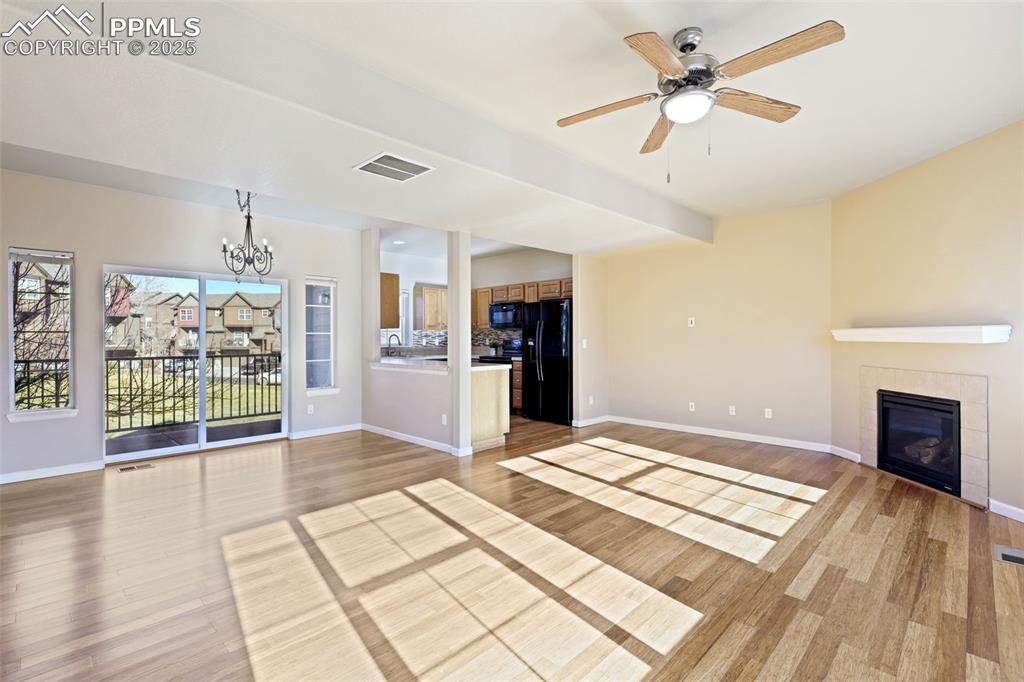 4058 Star View Colorado Springs, CO 80907 - Photo 12 of 43 a view of livingroom with hardwood floor and a ceiling fan