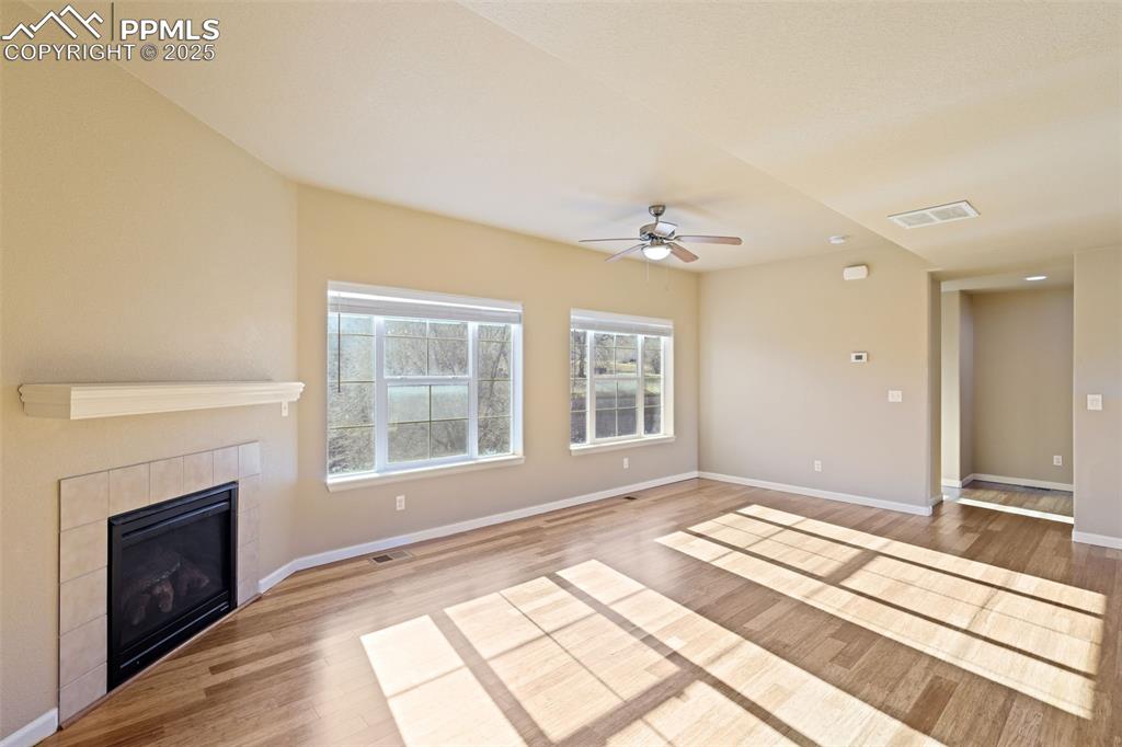 4058 Star View Colorado Springs, CO 80907 - Photo 13 of 43 a view of a livingroom with a fireplace and windows