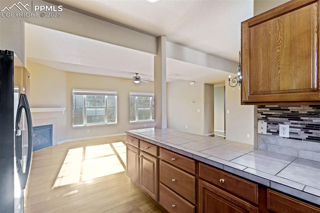4058 Star View Colorado Springs, CO 80907 - Photo 19 of 43 a spacious bathroom with a granite countertop sink and a window