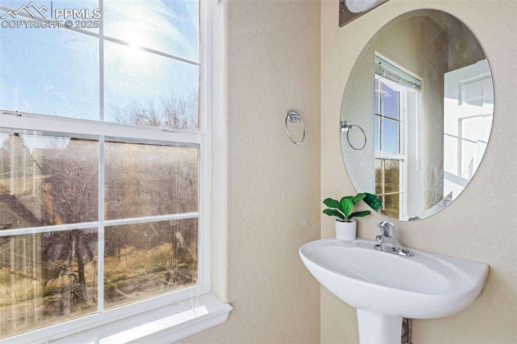 4058 Star View Colorado Springs, CO 80907 - Photo 20 of 43 a bathroom with a sink and a mirror