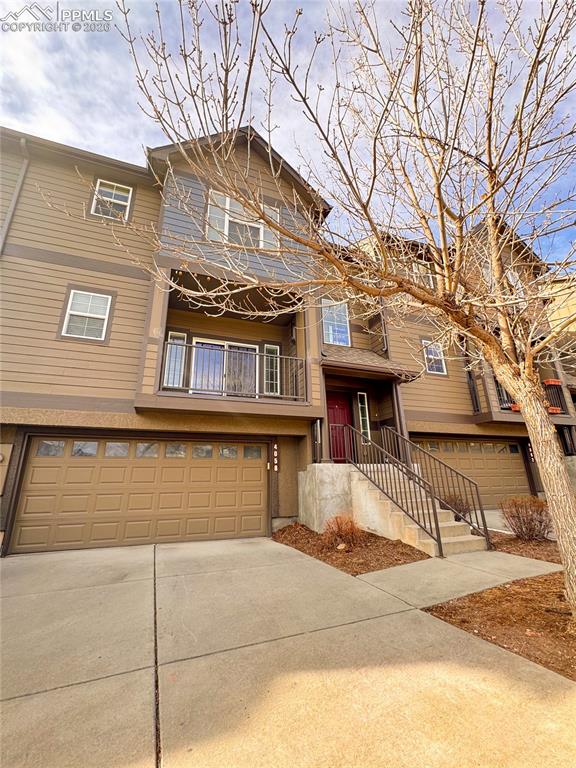 4058 Star View Colorado Springs, CO 80907 - Photo 2 of 43 a front view of a house with a garage