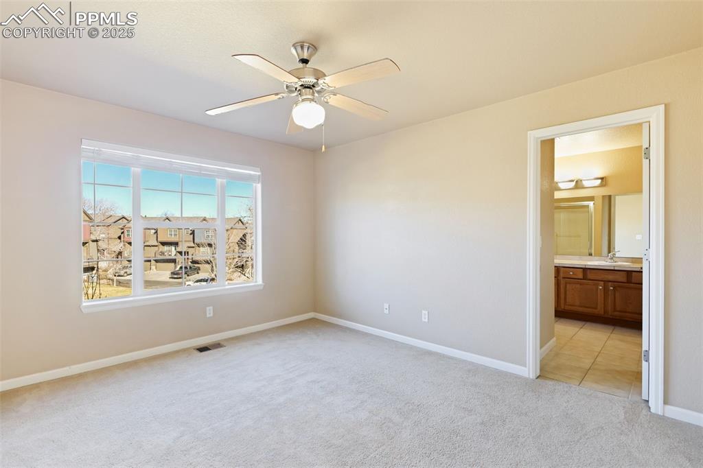 4058 Star View Colorado Springs, CO 80907 - Photo 24 of 43 a view of an empty room with a window