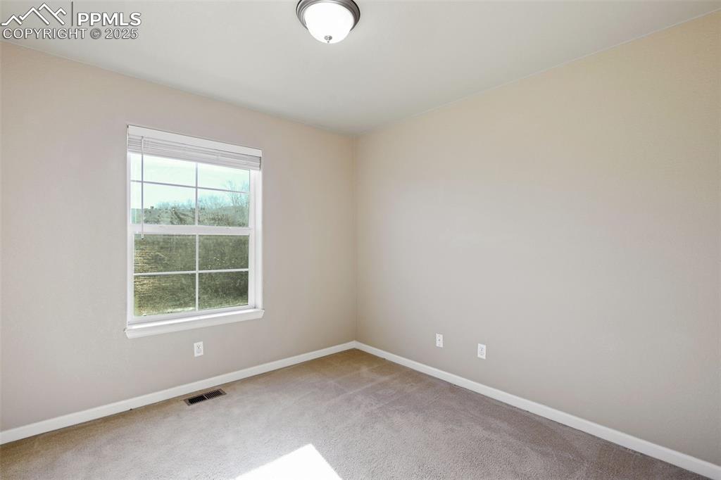 4058 Star View Colorado Springs, CO 80907 - Photo 29 of 43 an empty room with a window
