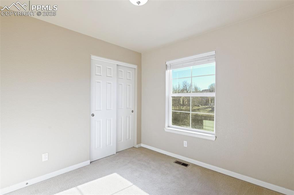 4058 Star View Colorado Springs, CO 80907 - Photo 30 of 43 a view of an empty room with a window