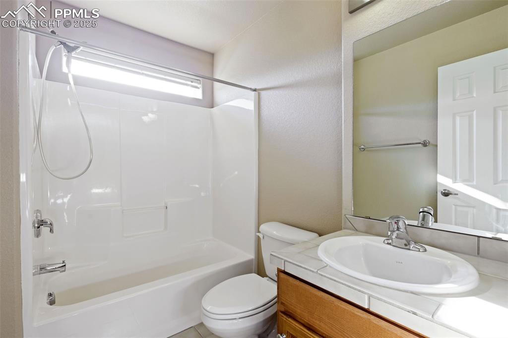 4058 Star View Colorado Springs, CO 80907 - Photo 33 of 43 a bathroom with a sink toilet and shower