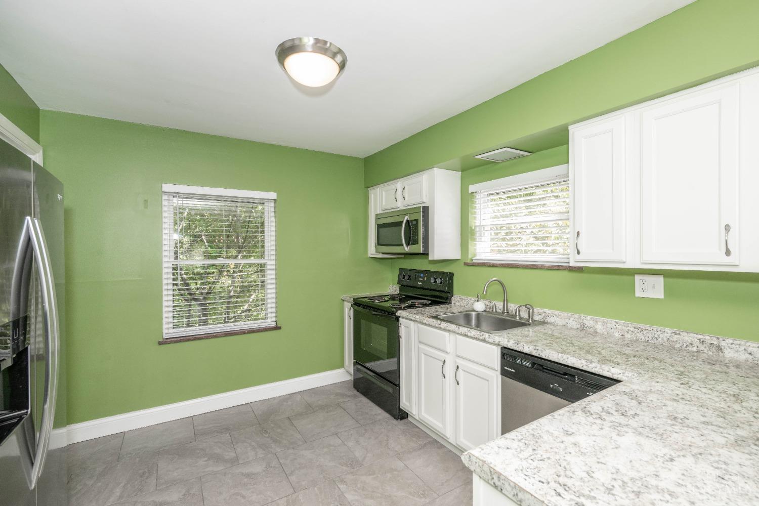 7396 Dawson Road Madeira, OH 45243 - Photo 14 of 42 The updated Kitchen has an efficient layout and great counter space as well as a view of the wooded back yard!
