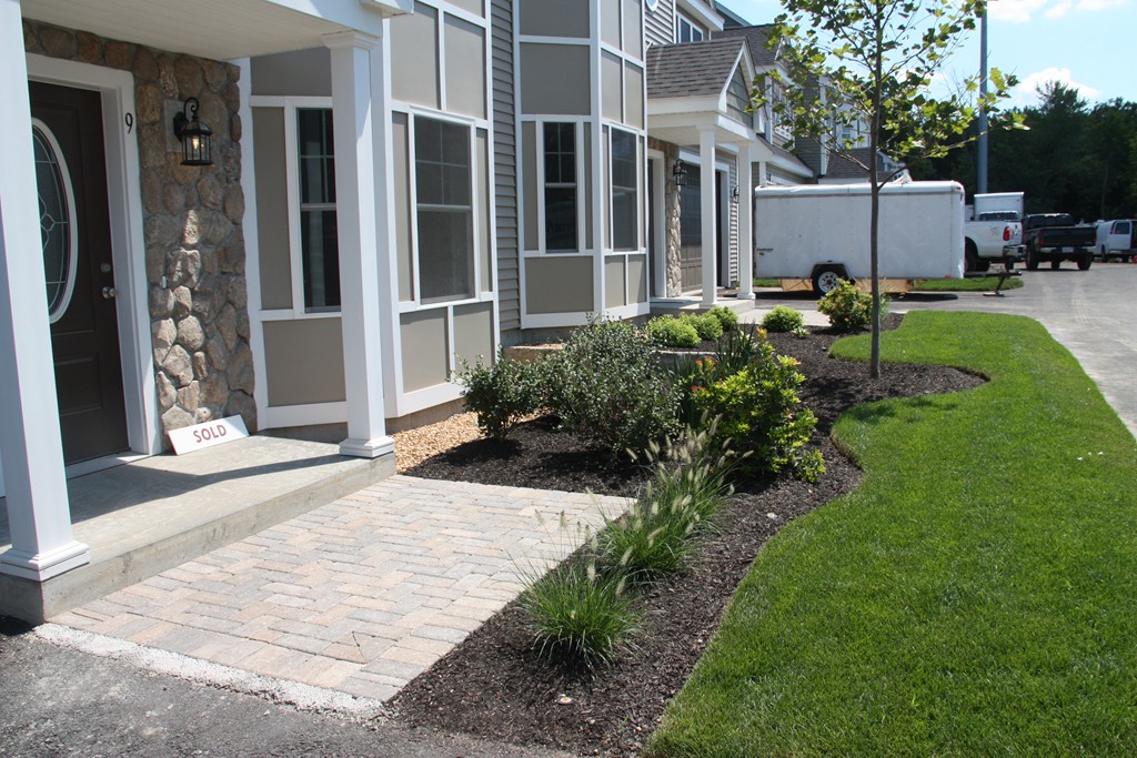 129 Acton Street, Unit 16 Maynard, MA 01754 - Photo 2 of 3 a backyard of a house with seating space