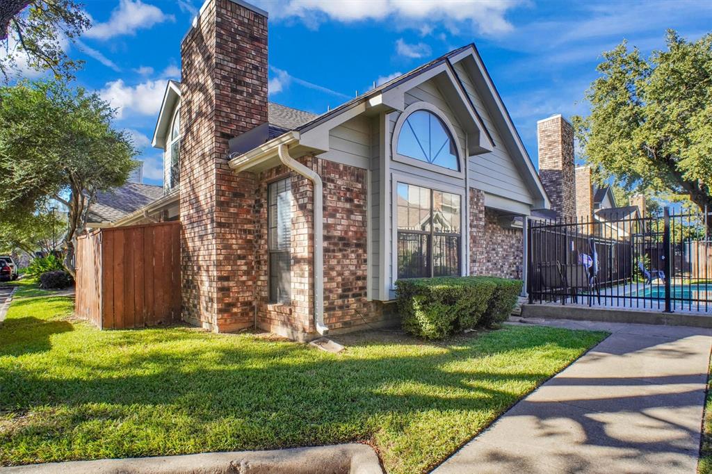 449 Harris Street, Unit I102 Coppell, TX 75019 - Photo 33 of 33 a front view of a house with garden