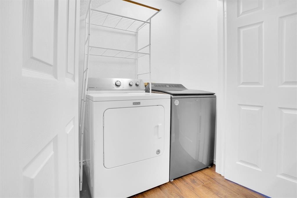 449 Harris Street, Unit I102 Coppell, TX 75019 - Photo 14 of 33 a utility room with dryer and washer
