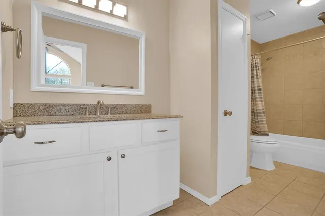 a view of storage and utility room with wooden floor